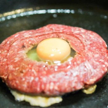 A beef burger with an egg in the middle recipe